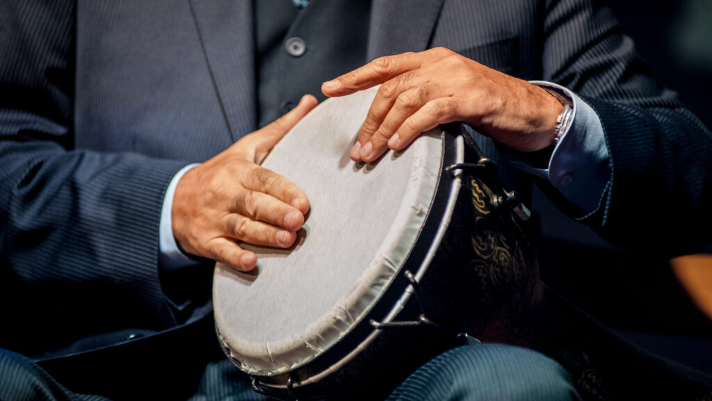 Hands,Of,Men,Playing,On,The,Drum